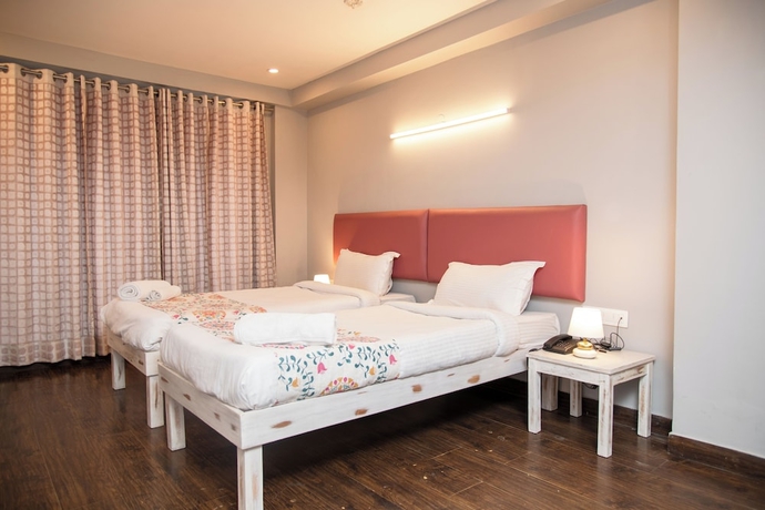 Imagen de la habitación del Hotel 30 Vamsor Heights. Foto 11