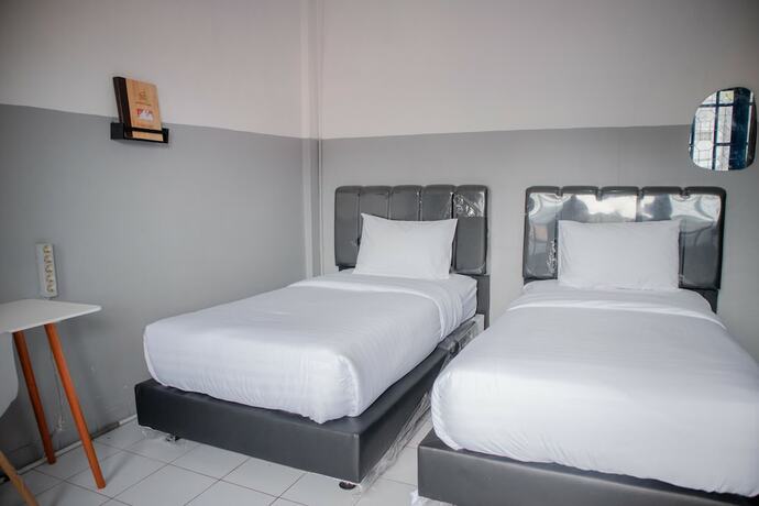 Imagen de la habitación del Hotel 360Homestay. Foto 6