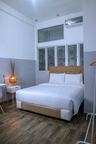 Imagen de la habitación del Hotel 360Homestay. Foto 8