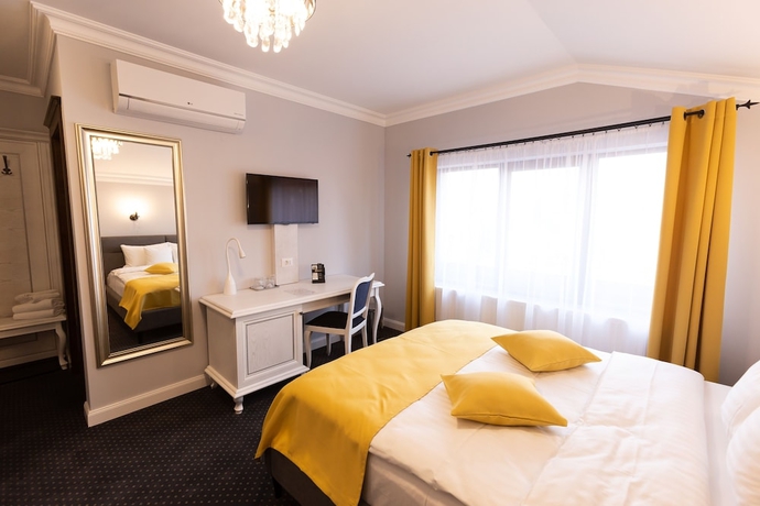 Imagen de la habitación del Hotel 4Cardinals Boutique. Foto 9