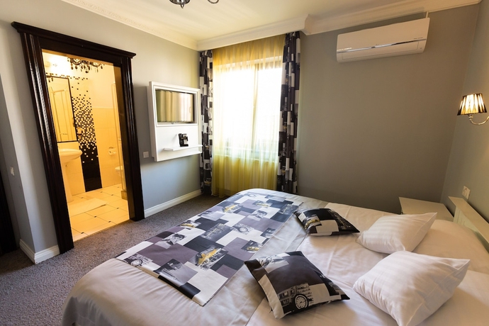 Imagen de la habitación del Hotel 4Cardinals Boutique. Foto 15