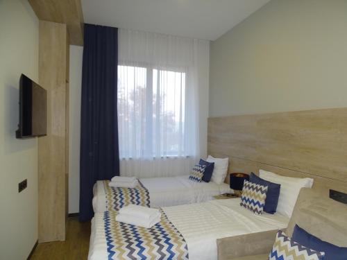 Imagen de la habitación del Hotel 4Guest. Foto 19