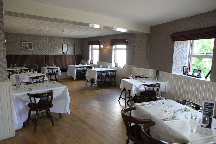 Imagen del bar/restaurante del Hotel 5 Corners Guest Inn. Foto 3