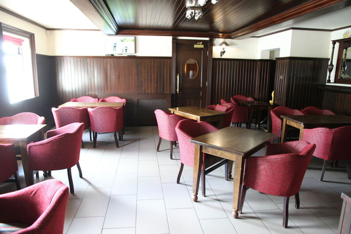 Imagen del bar/restaurante del Hotel 5 Corners Guest Inn. Foto 7