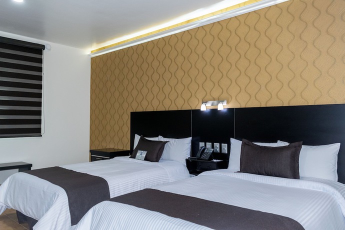 Imagen de la habitación del Hotel 5 Inn Plus. Foto 11