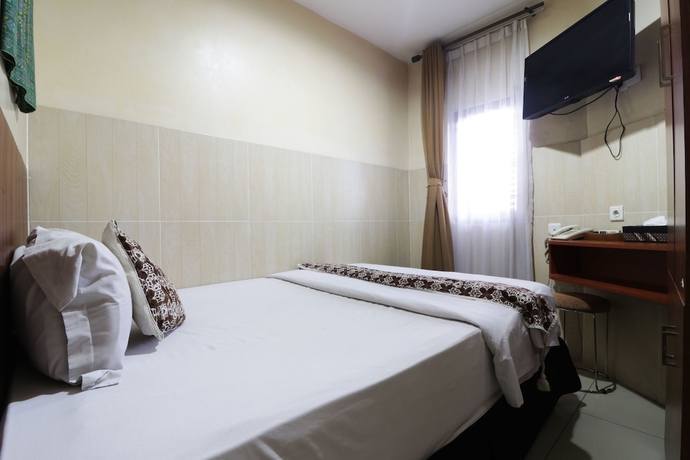 Imagen de la habitación del Hotel 58 Guesthouse Tangerang. Foto 10