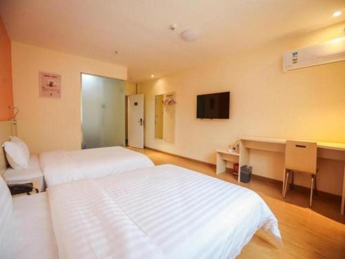 Imagen general del Hotel 7 Days Inn Yunfu Bus Terminal Yihua International Plaza. Foto 2