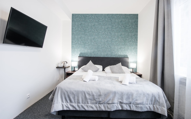 Imagen de la habitación del Hotel 7Days BandB. Foto 13