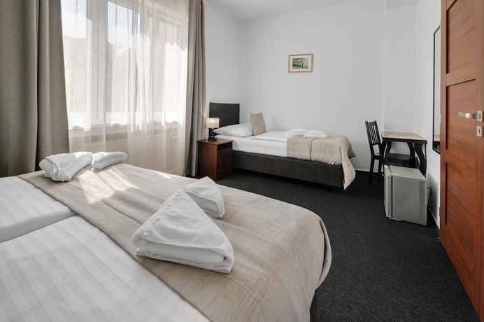 Imagen de la habitación del Hotel 7Days BandB. Foto 15