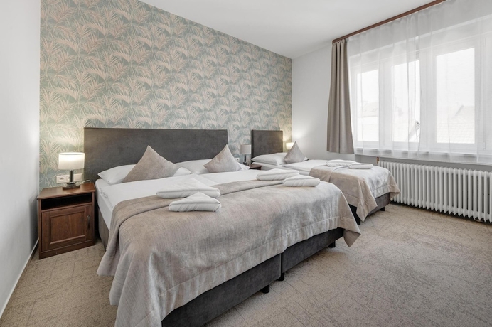 Imagen de la habitación del Hotel 7Days BandB. Foto 18