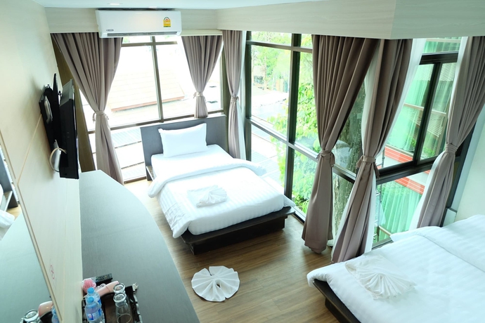 Imagen de la habitación del Hotel A Plus Deluxe. Foto 16