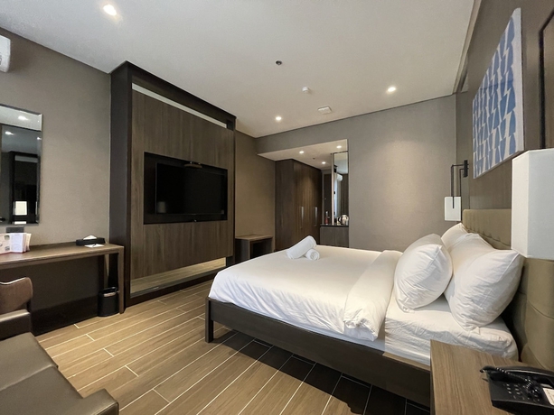 Imagen de la habitación del Hotel A and A Quezon City powered by Cocotel. Foto 9