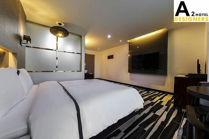 Imagen de la habitación del Hotel A2 Designers. Foto 18
