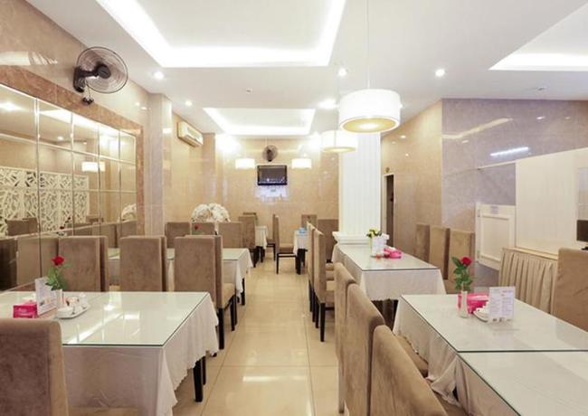 Imagen del bar/restaurante del Hotel A25 De Tham Hotel. Foto 5