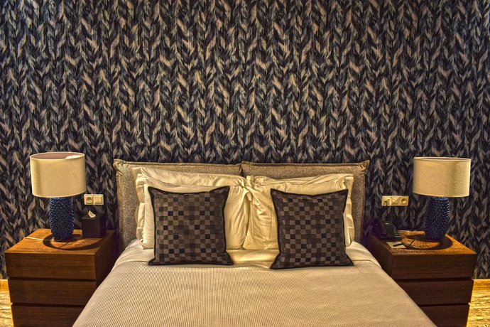 Imagen de la habitación del Hotel ADAM Suites. Foto 16