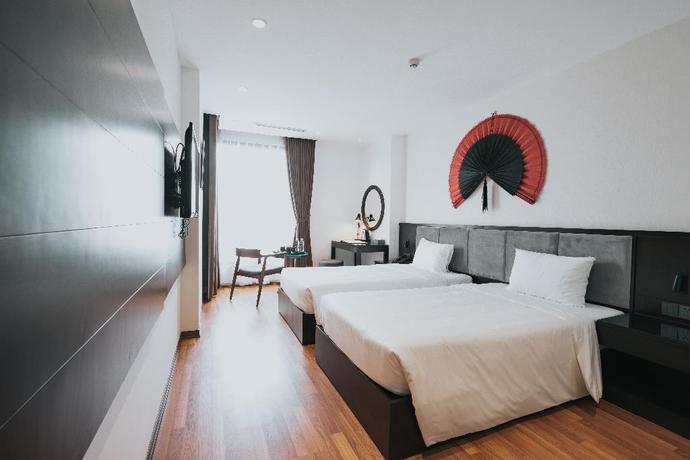 Imagen de la habitación del Hotel AHA COMMENCER HOTEL HANOI. Foto 11