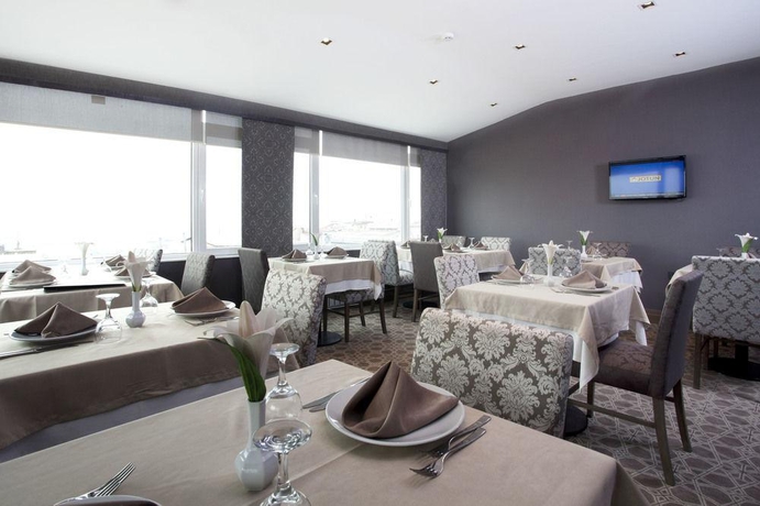 Imagen del bar/restaurante del Hotel AHC Grand Bazaar. Foto 1