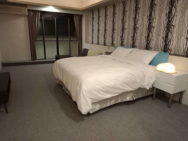 Imagen de la habitación del Hotel AI YUE HOTEL. Foto 6