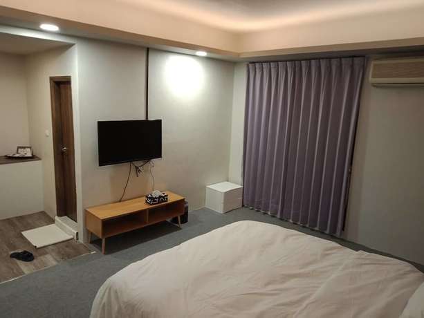 Imagen de la habitación del Hotel AI YUE HOTEL. Foto 7