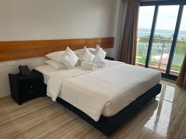 Imagen de la habitación del Hotel AIMI Beach, Gulhi Island, Maldives. Foto 16
