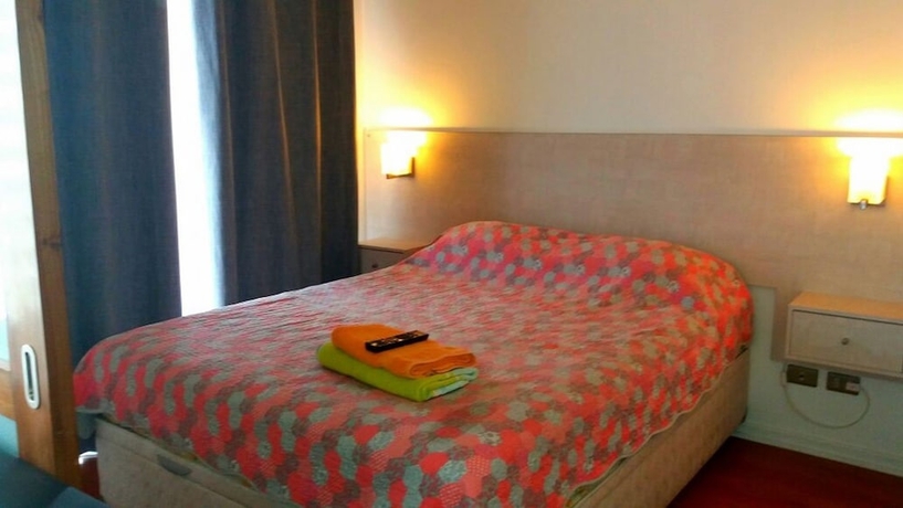 Imagen de la habitación del Hotel AM Departamentos. Foto 6