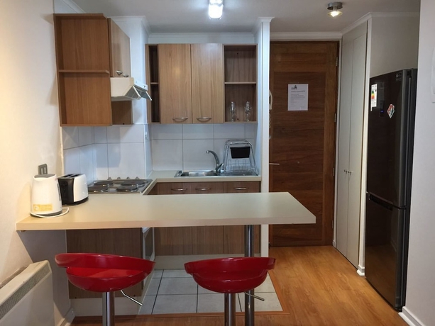 Imagen de la habitación del Hotel AM Departamentos. Foto 11