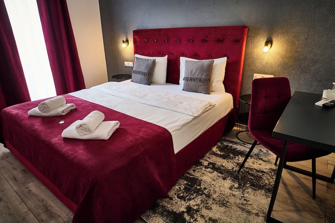 Imagen de la habitación del Hotel AMEL ROOMS. Foto 9