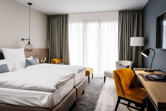 Imagen de la habitación del Hotel AMERON Neuschwanstein Alpsee Resort and Spa. Foto 17