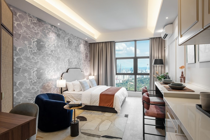 Imagen de la habitación del Hotel AMI Suites. Foto 11