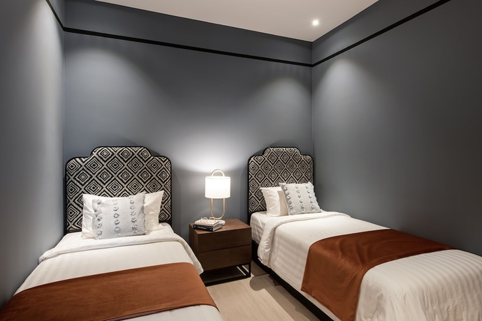 Imagen de la habitación del Hotel AMI Suites. Foto 12