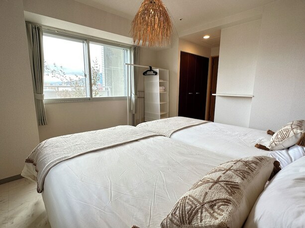 Imagen de la habitación del Hotel AMS Tower Nakajima. Foto 19