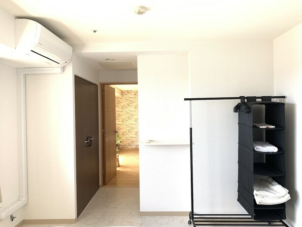 Imagen de la habitación del Hotel AMS Tower Nakajima. Foto 30
