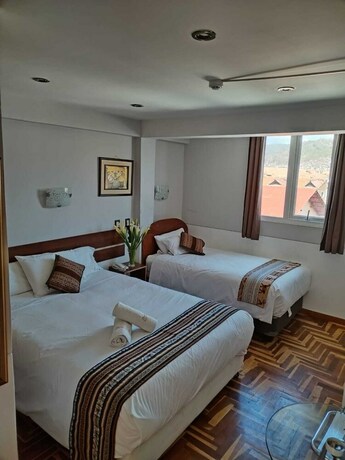 Imagen de la habitación del Hotel AMTALLPA SAN BLAS INN. Foto 8