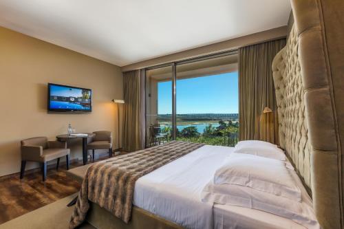 Imagen de la habitación del Hotel AP Lago Montargil Conference & Spa. Foto 14