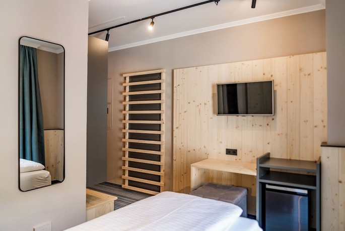 Imagen de la habitación del Hotel APPARTHOTEL FERIENALM. Foto 11