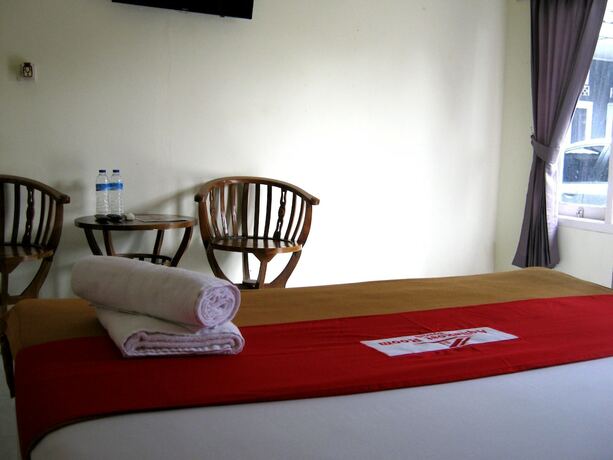 Imagen de la habitación del Hotel AQILAKOST n CAFE Gadog Puncak. Foto 19