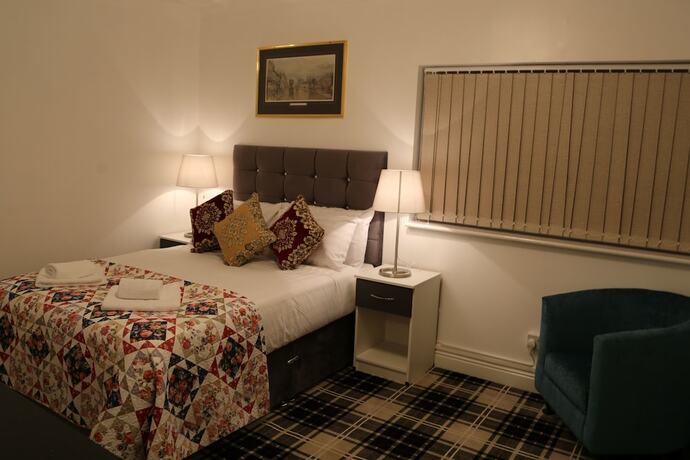 Imagen de la habitación del Hotel ATZandH Inn. Foto 12