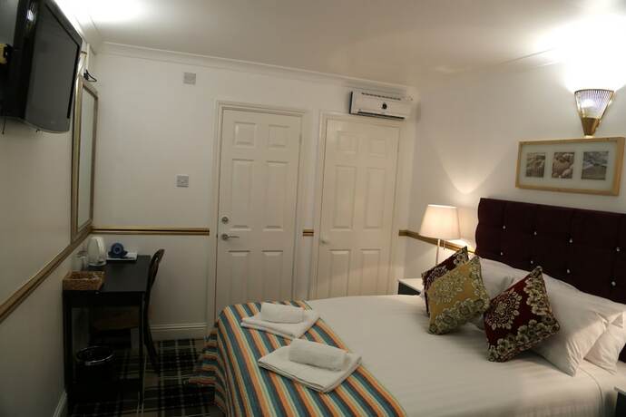Imagen de la habitación del Hotel ATZandH Inn. Foto 14