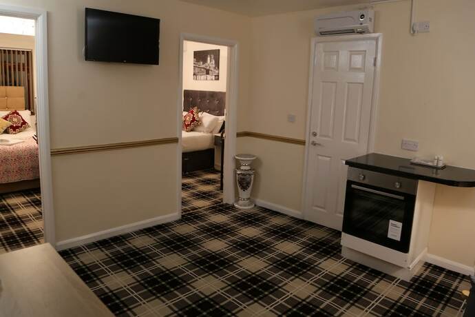 Imagen de la habitación del Hotel ATZandH Inn. Foto 16