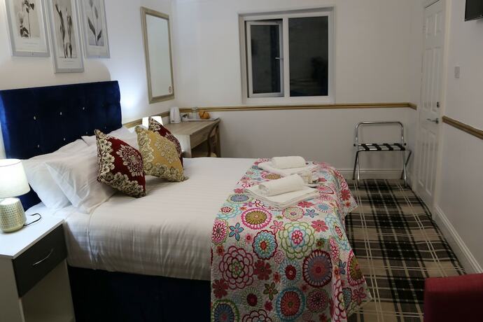 Imagen de la habitación del Hotel ATZandH Inn. Foto 17