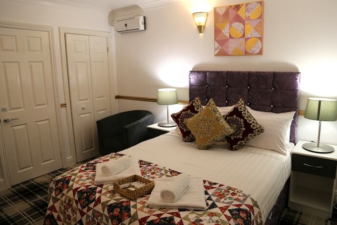 Imagen de la habitación del Hotel ATZandH Inn. Foto 18