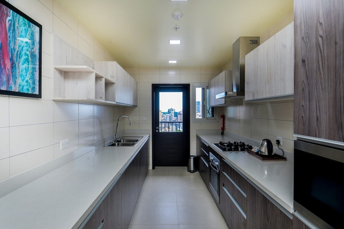 Imagen de la habitación del Hotel AURA SUITES, DAR ES SALAAM. Foto 11