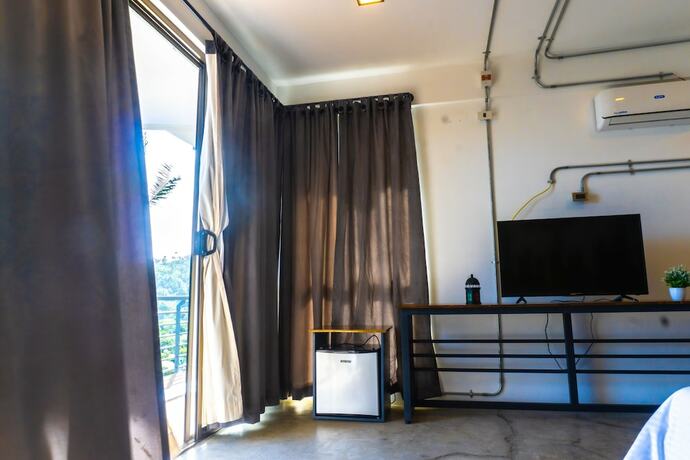 Imagen de la habitación del Hotel AV Suites. Foto 11