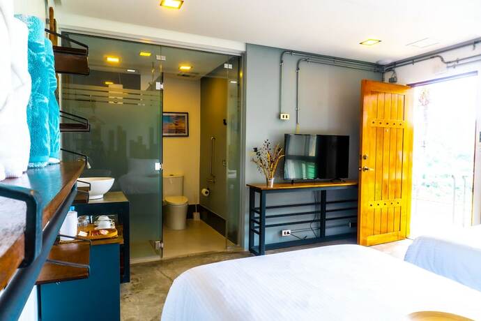 Imagen de la habitación del Hotel AV Suites. Foto 12