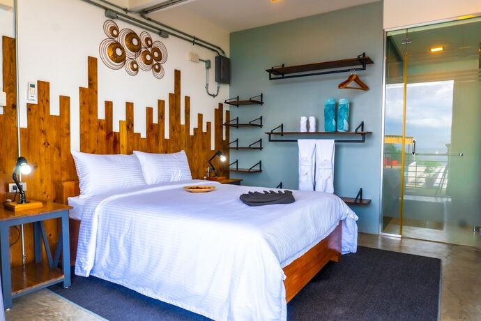 Imagen de la habitación del Hotel AV Suites. Foto 18