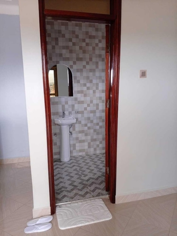 Imagen de la habitación del Hotel AYEBA ZION HOTEL. Foto 13