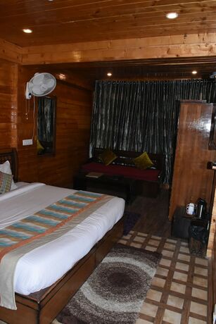 Imagen de la habitación del Hotel Aanantham Country Resort. Foto 17