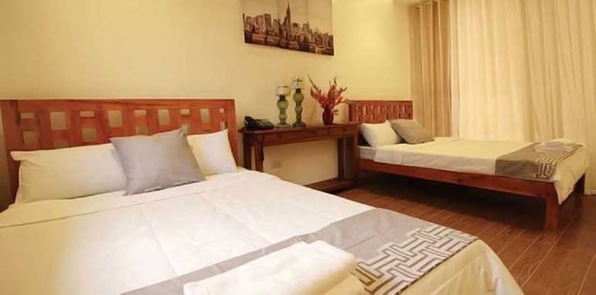 Imagen de la habitación del Hotel AandA Garden Suites. Foto 14