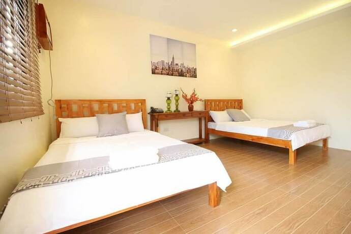 Imagen de la habitación del Hotel AandA Garden Suites. Foto 15