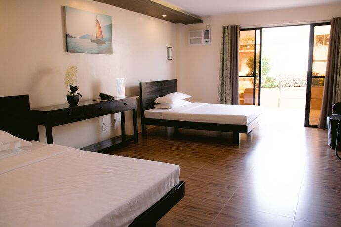 Imagen de la habitación del Hotel AandA Garden Suites. Foto 16